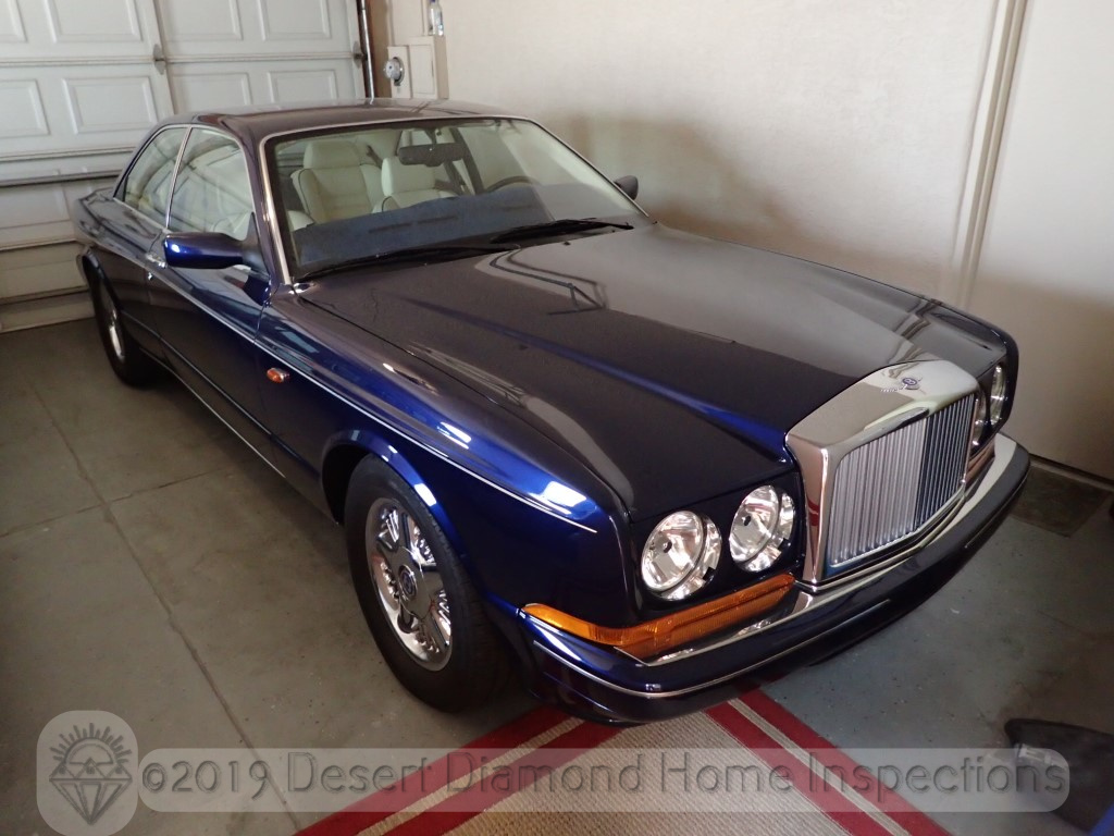 A shiny blue Bentley.