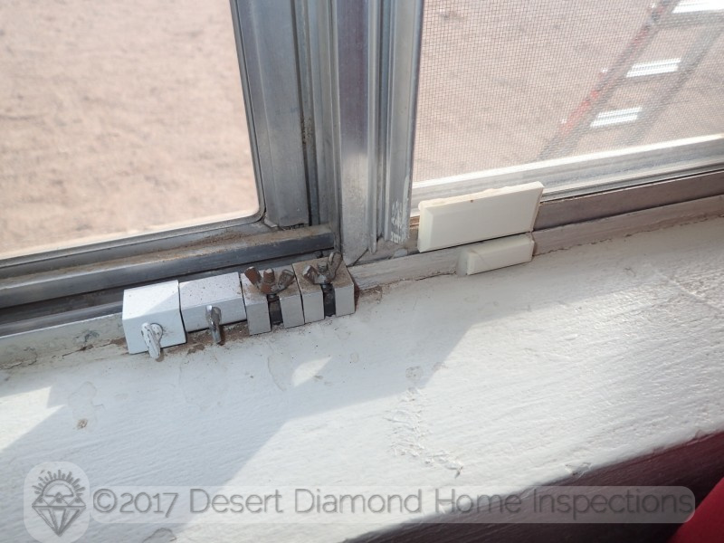 This home owner takes their security serious: an alarm sensor plus four window locks - on a single-pane window