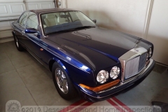 A shiny blue Bentley.