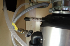 The connection for the dishwasher drain hose at the garbage disposal was open but there was no dishwasher. What to do? Just glue a permanent marker in the hole. Problem solved!