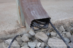 Dear TV installer: This is a downspout, not a conduit. It is meant for rain water, not for TV cable...