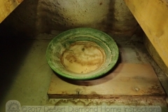 Why fix a leak when you can just put a bowl in there to catch the water?