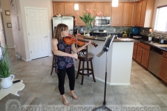 The lovely and talented Kaety Byerley providing live music during a home inspection