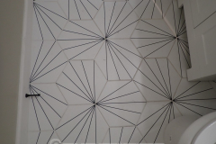 This bathroom floor tile layout gave me an aneurysm. This is just wrong. 