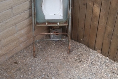 We have no idea what lead somebody to construct this contraption found in a backyard. We hope the poop is from the resident pooch.