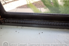 No chintzy PVC or wooden dowel for this window: A piece of steel rebar. It even has a lanyard to easily lift it out of the window track