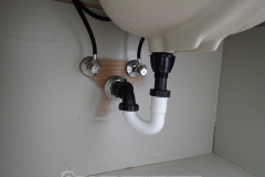 It's under the sink. Nobody's gonna look here anyway, so who cares?